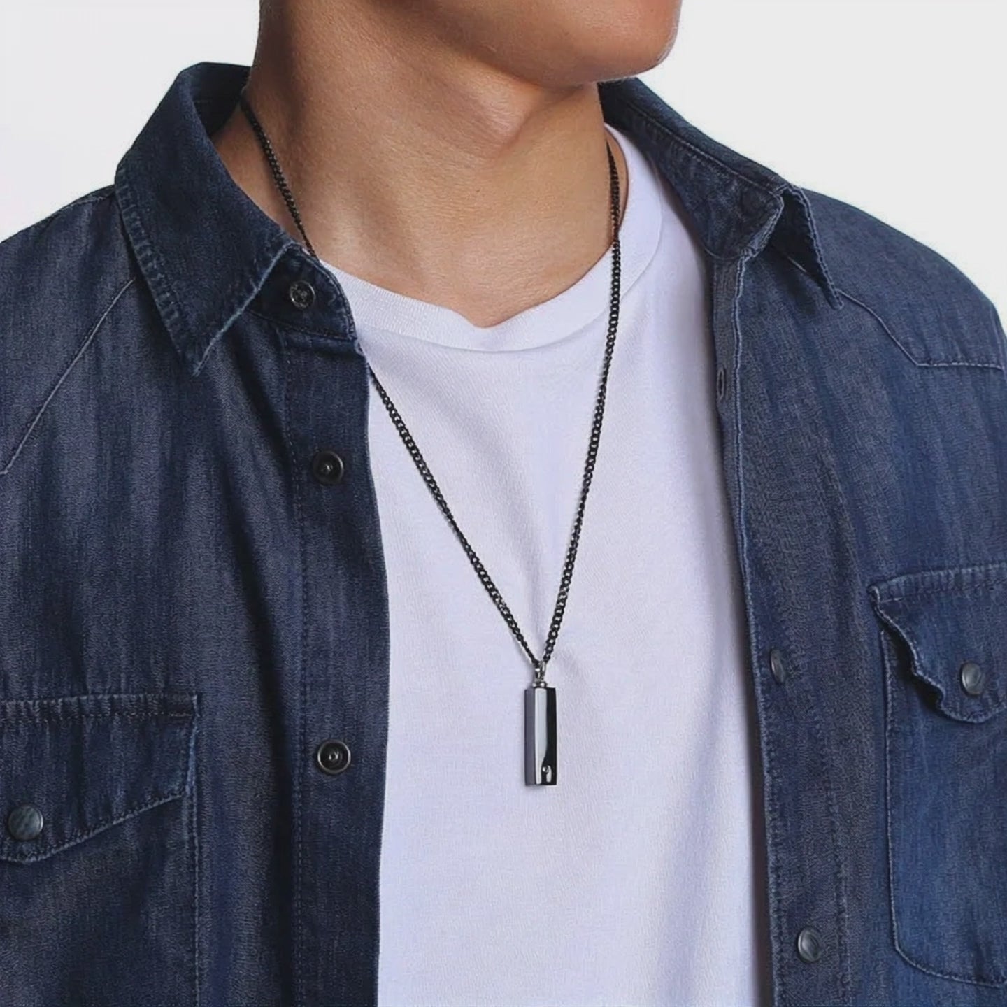 Video of model wearing customized black rectangular urn necklace for men and women