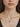 video of a woman wearring heart ribbon cremation heart jewelry